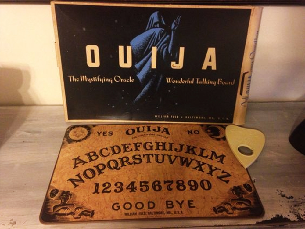 A pre-Parker Brothers Ouija box, board, and planchette. 